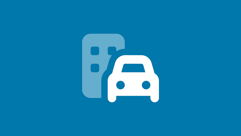 Car in front of a building icon