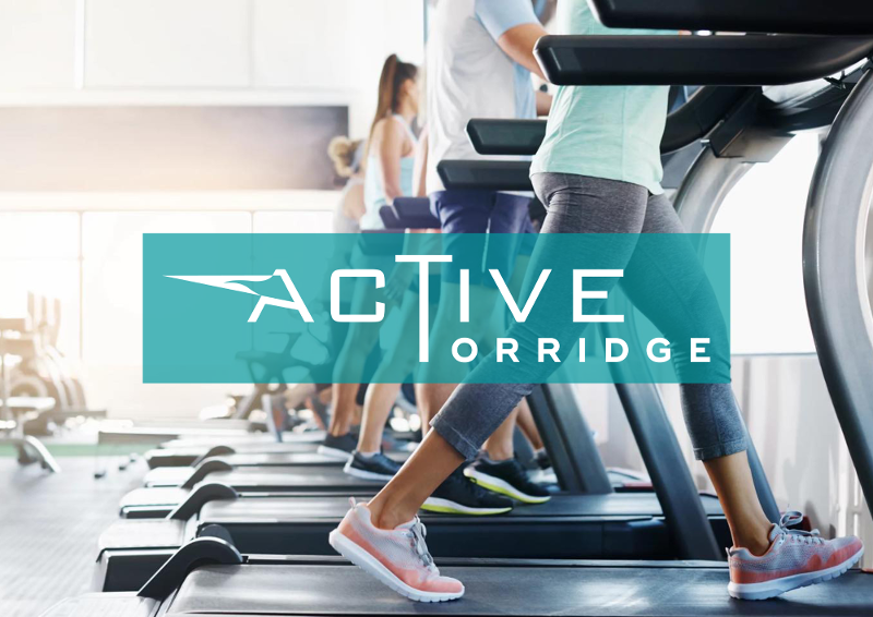 Active Torridge Logo Gym in front of People on Treadmills