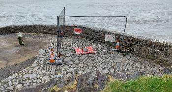View of Bucks Mills slipway with fenced off section and warning stay clear signs