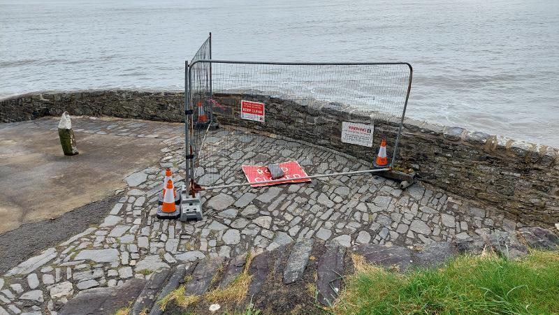 View of Bucks Mills slipway with fenced off section and warning stay clear signs