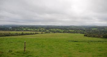 DCA 36: Popular viewpoint at Hatherleigh Moor looking southwards across pasture fields enclosed by hedges with trees towards Dartmoor. 