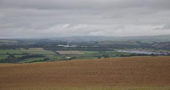 DCA 53: Kingsland Barton solar farm and the Norbord factory (with smoke plume) forming large-scale developments in the landscape near South Molton (as viewed from elevated land in the Taw Valley DCA).