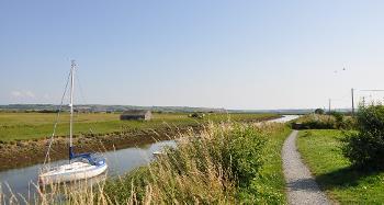 DCA 58: The River Caen near Velator Quay, with grazing marsh and characteristic 'linhay' animal shelter.