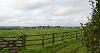 DCA 63: View north-west across pony paddocks towards Beaford. Three wind turbines at Darracott Moor (in DCA 32) are visible on the skyline.