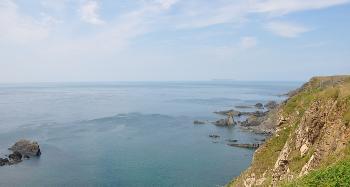 LCT 4H Cliffs at Hartland Quay, with the outline of Lundy on the horizon