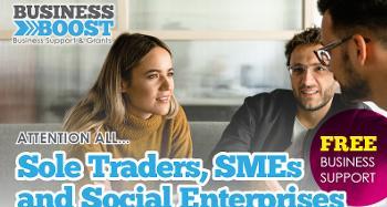 Picture of man and a woman in a business meeting with text business boost attention all Sole Traders, SME's and social enterprises free business support