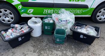Picture of various recycling containers, all full with plastic 