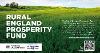 Picture of vivid green field with blue sky and the text Rural England Prosperity Fund