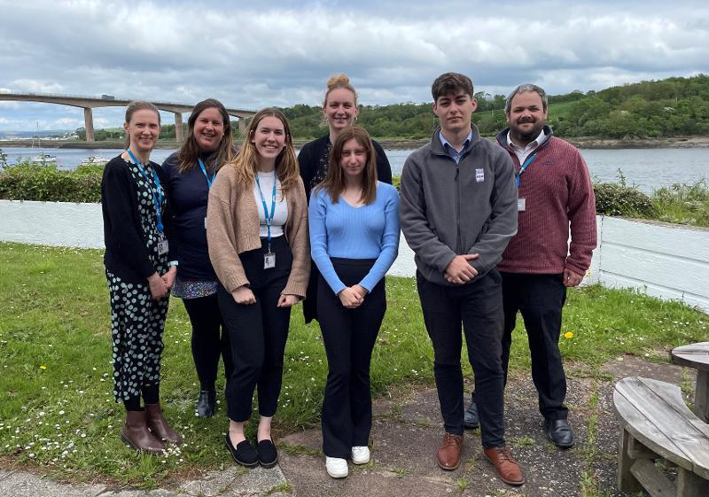 Picture of Apprentices and staff from their departments smiling for a photo outside