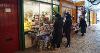 Image of people shopping in local shops at Bideford Pannier Market.