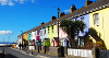 The view of a colourful street in Westward Ho! in the sunshine